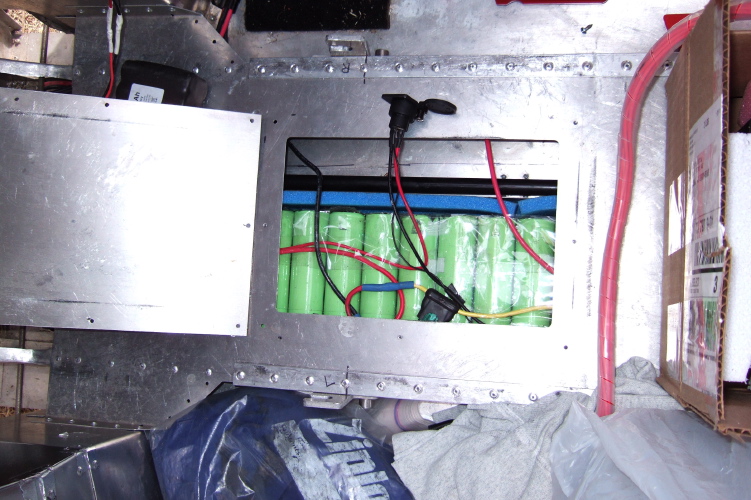 Battery compartment under seat.