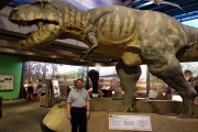 Len stand before the T-rex.
