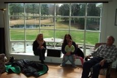Laura, Janice, Natalie, a shy Camille, and David in the living room
