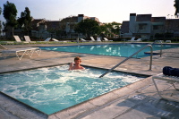 Chris enjoys a soak in the jaccuzzi and a can of Coke.