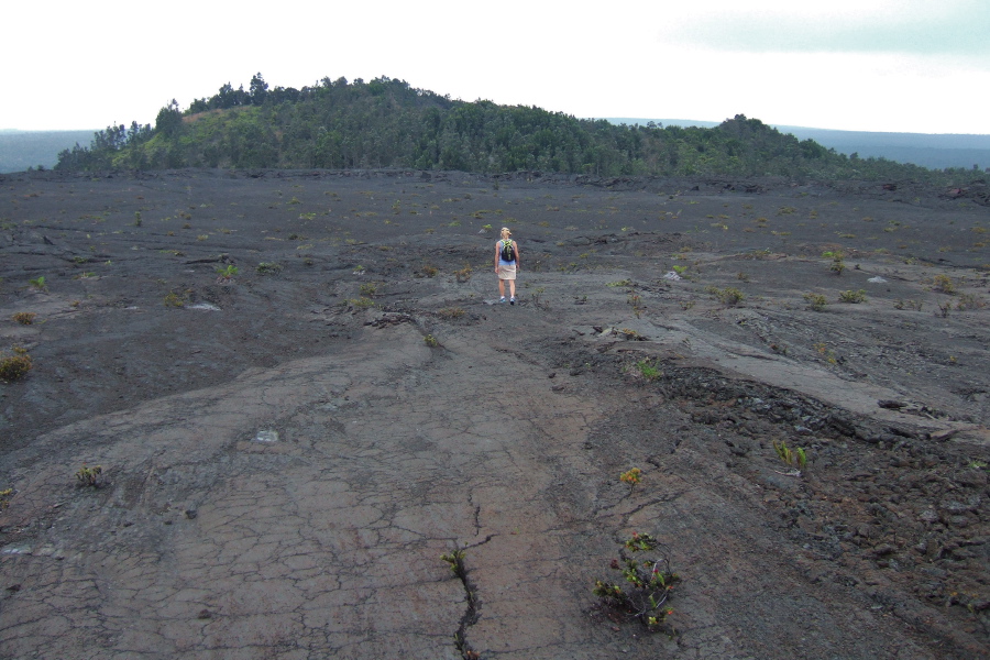 Laura leads the way down the hardened pahoehoe flows toward Pu'u Huluhulu.