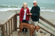 Kay, David, and Kumba on a stairway to the water